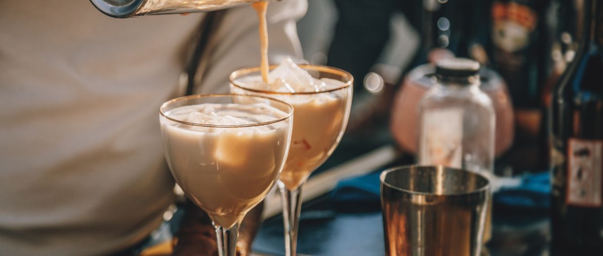 Bartender making cream cocktails